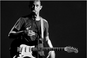 Joseph Levitt playing guitar live b/w